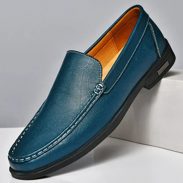 Durable sole on men's slip-on loafers, ensuring long-lasting comfort & refined grip for everyday elegant wear.