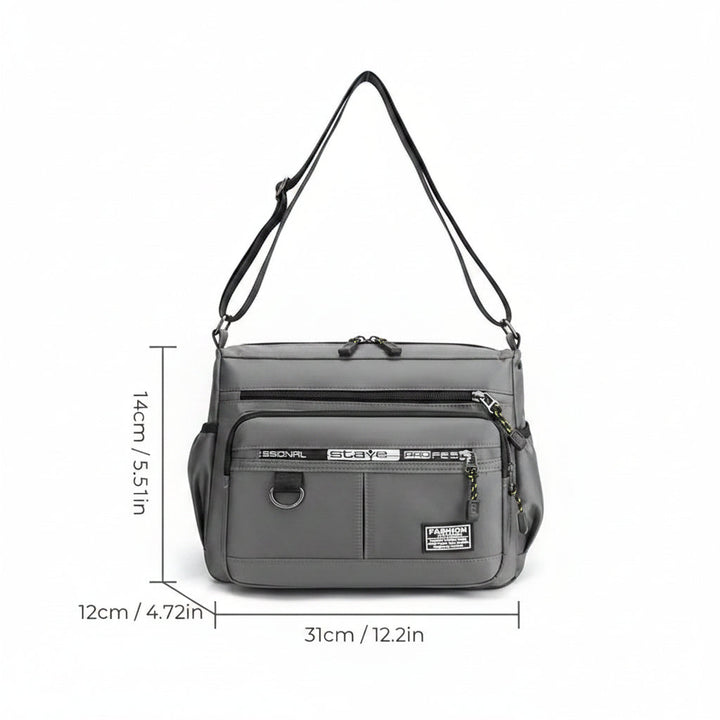 Man wearing a durable men's messenger bag, ideal for urban travel and daily use.