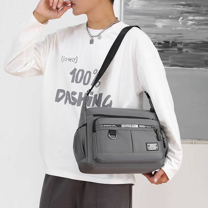 Side profile of a versatile men's shoulder bag, multi-pocket design for optimal organization.