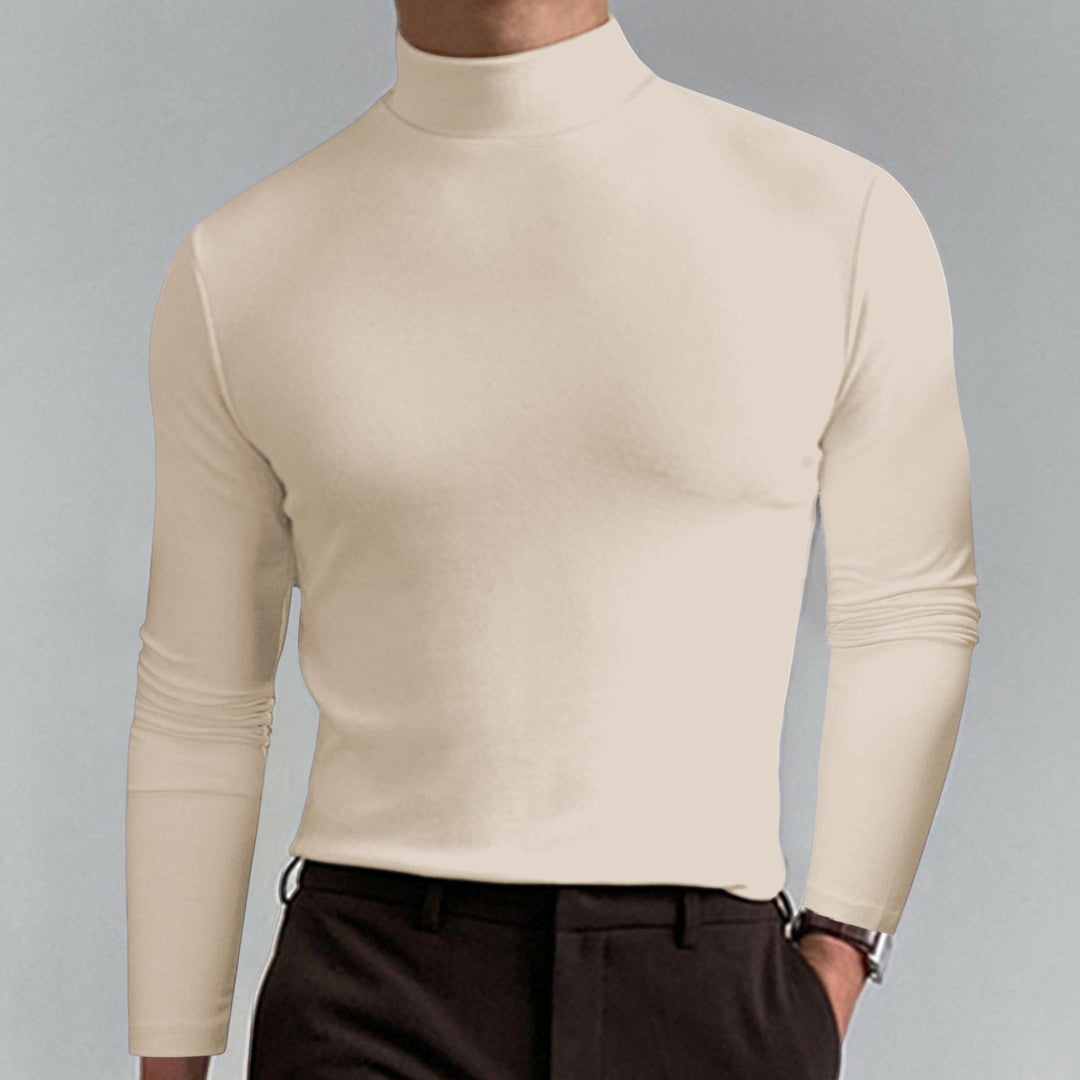 Close-up of a men's fine cotton blend turtleneck sweater, showing knit texture.