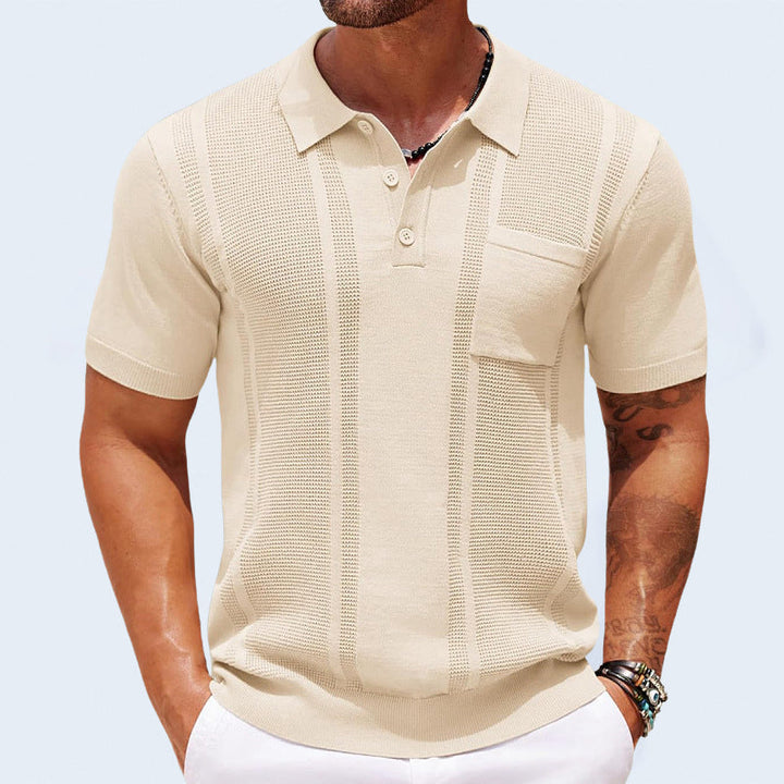Close-up of the chest pocket detail on the men's Finley knit polo shirt.