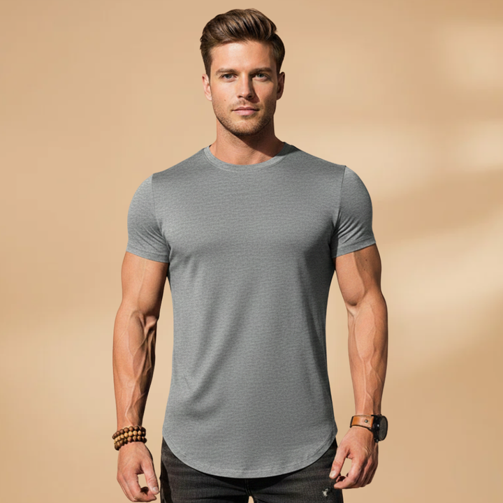 Fitted men's workout shirt for enhanced performance. Quick-dry athletic activewear, ideal for gym training.