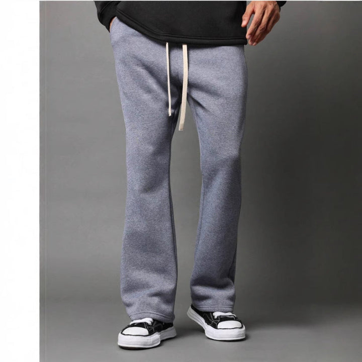 Stylish men's black flared sweatpants. Relaxed fit for casual wear, ideal for everyday comfort & modern loungewear.