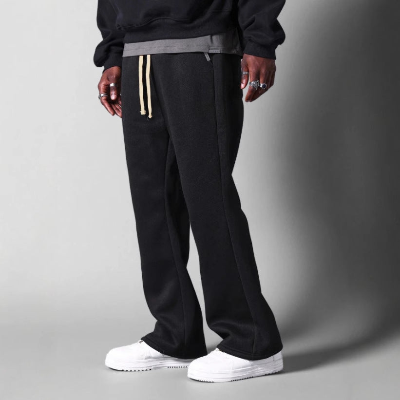 Comfortable men's flared sweatpants in light grey. Relaxed fit, versatile for loungewear, casual outings, or activewear.