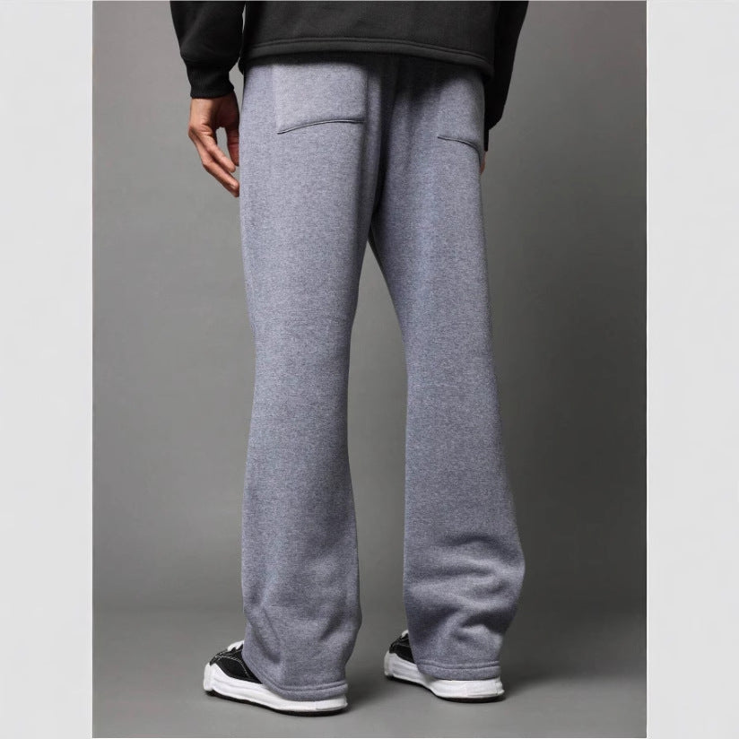 Fashionable men's flared sweatpants in light purple. Stylish comfort, perfect for modern loungewear & relaxed everyday wear.
