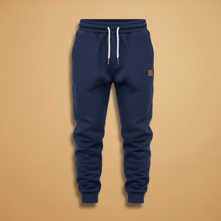 Men's fleece lined joggers in black with elastic waistband and drawstring.