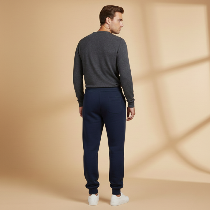 Side view of men's fleece joggers, highlighting the modern tapered fit.