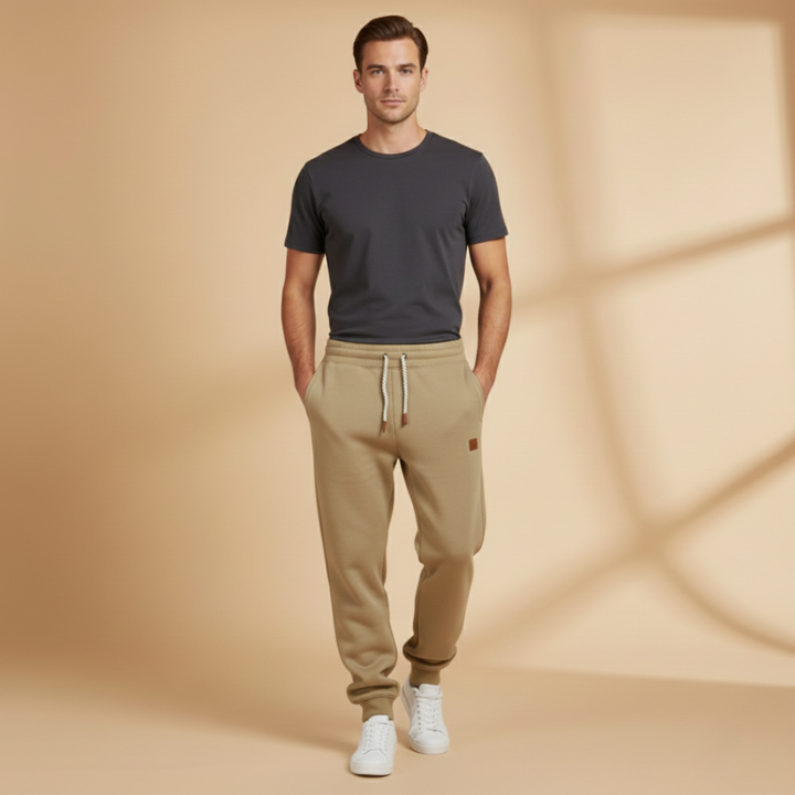 Men's black joggers with elastic waistband, perfect for cold weather.