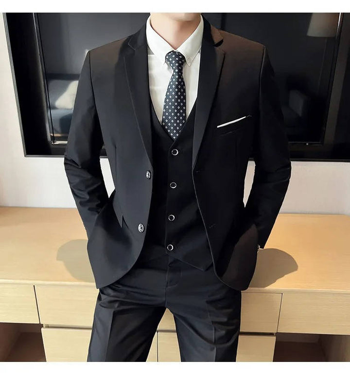 Classic menswear: a three-piece formal suit featuring a refined notch lapel for any occasion.