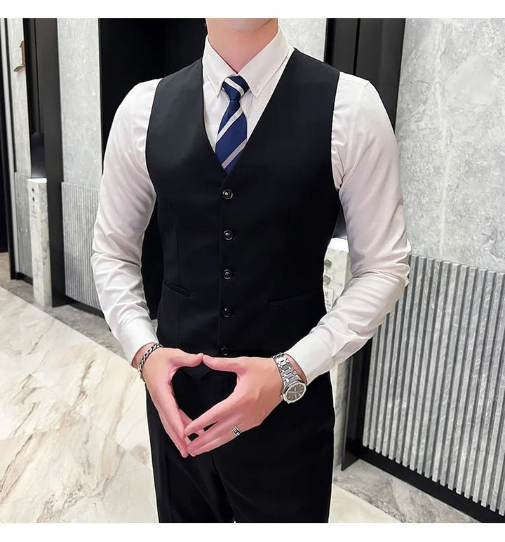 Complete men's formal wear: a three-piece suit with a classic notch lapel design.