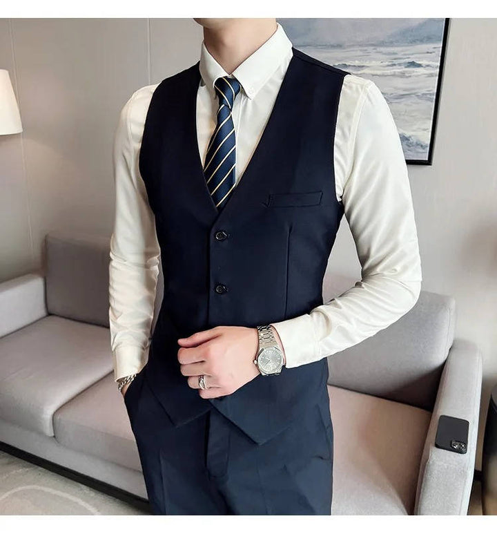 Professional men's business suit, three-piece, featuring a sharp notch lapel.