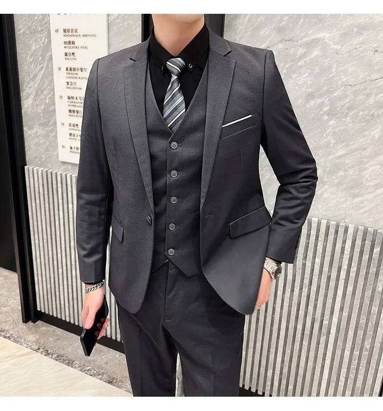 Timeless men's office attire, three-piece suit, classic notch lapel design.