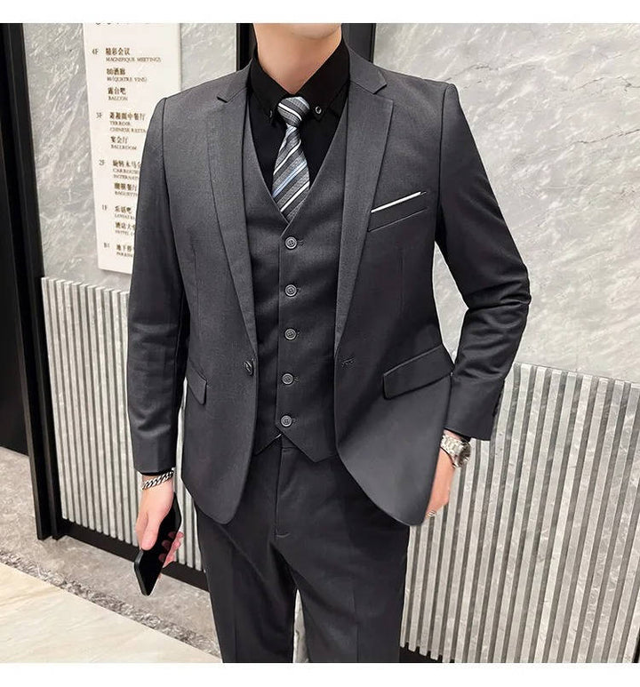 Timeless men's office attire, three-piece suit, classic notch lapel design.