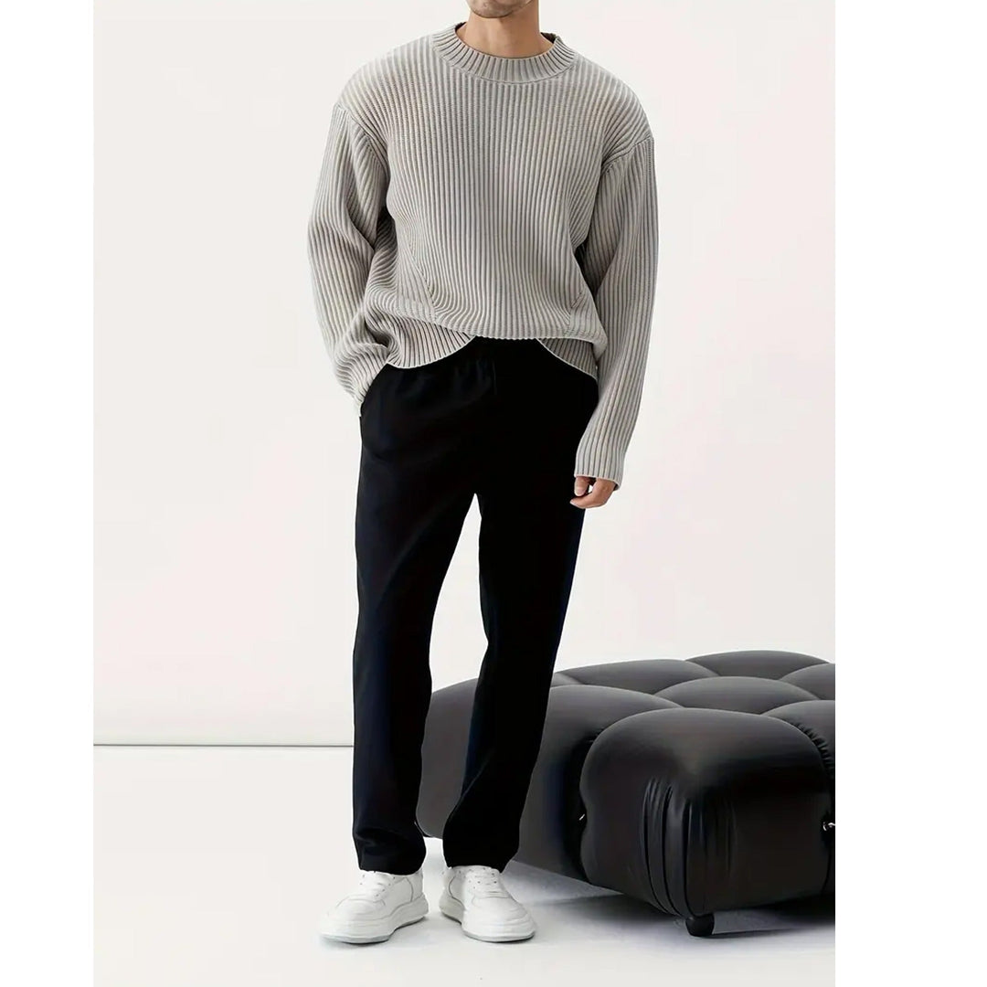 Close-up of a men's stylish grey relaxed fit crewneck sweater, offering ultimate casual comfort.
