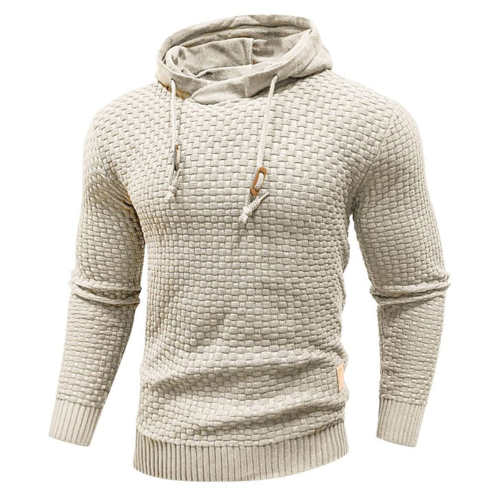 Stylish men's long sleeve textured hoodie in a classic pullover design. Ideal for layering.