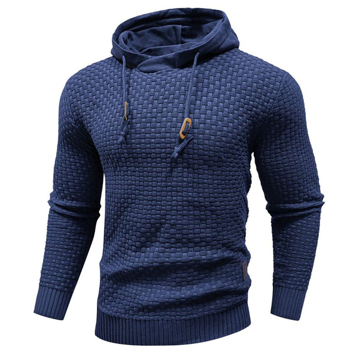 Modern men's textured casual hoodie with drawstring hood, great for comfortable layering.
