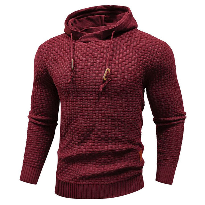 Layering men's textured pullover hoodie. Comfortable long sleeve design with modern appeal.
