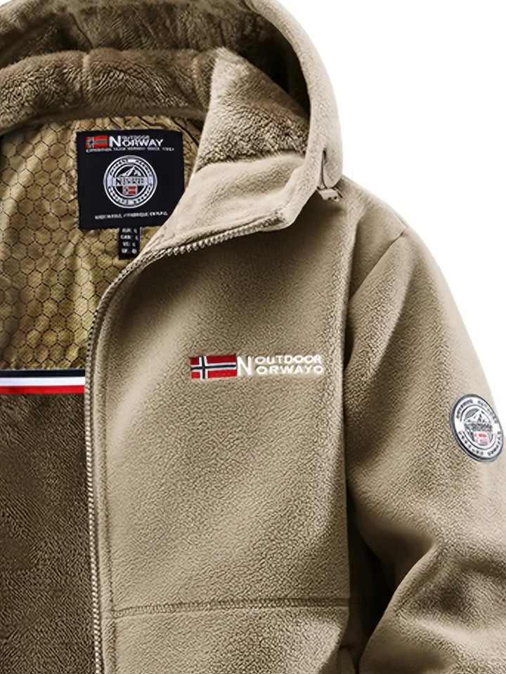 Close-up of the thick fleece lining inside a men's cold weather thermal jacket.