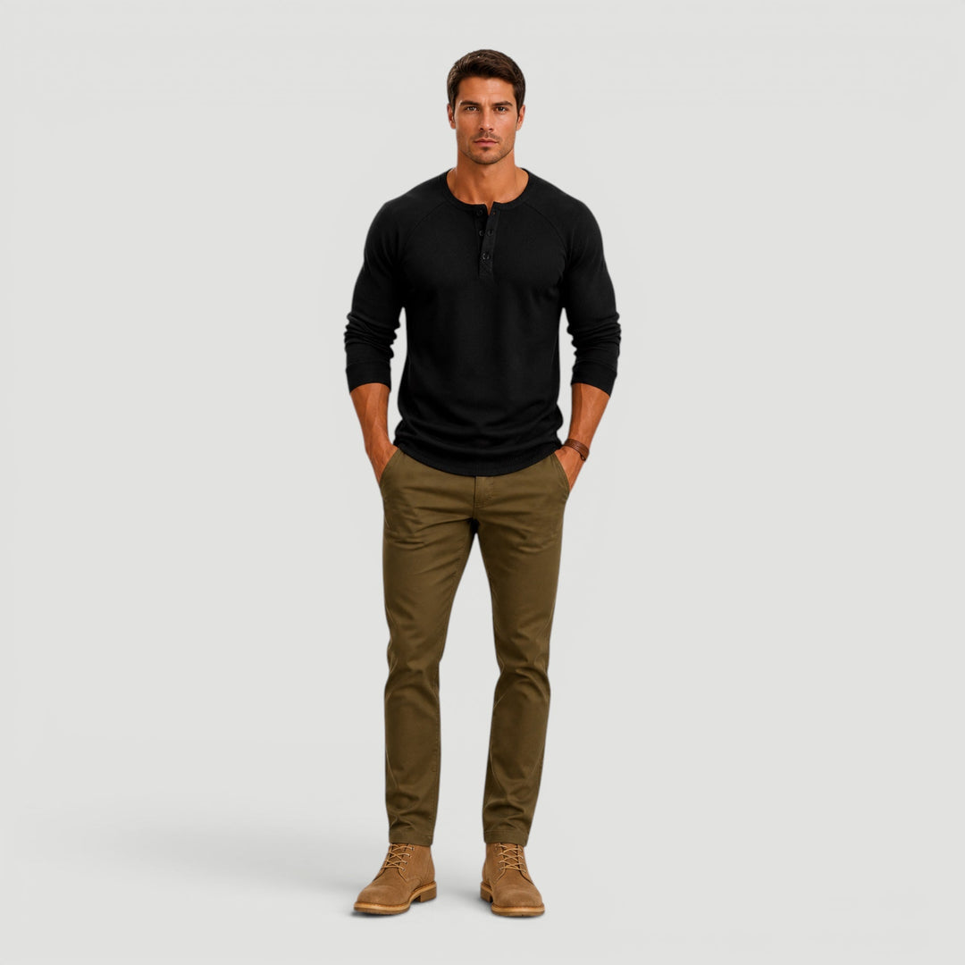 Comfortable men's long sleeve Henley sweater with button neck, ideal for casual everyday wear.