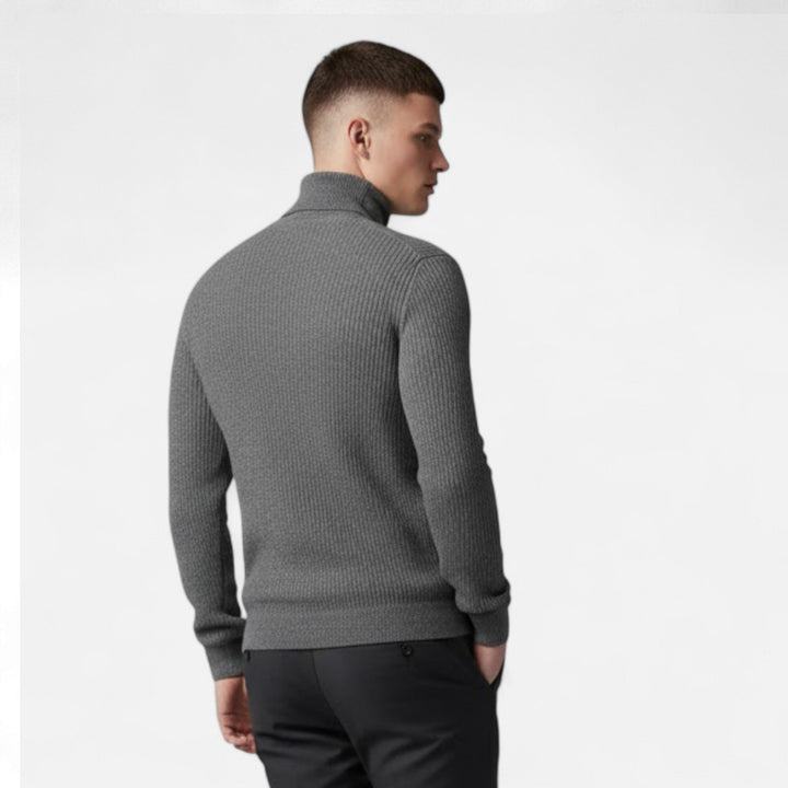 Men's fashionable grey high-lapel oversized pullover sweater, styled for a relaxed and sophisticated autumn look.
