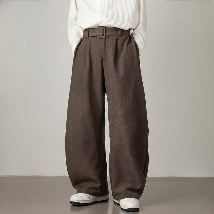 Men's high-waisted wide leg trousers with a pleated waist & adjustable belt, perfect for smart casual style.