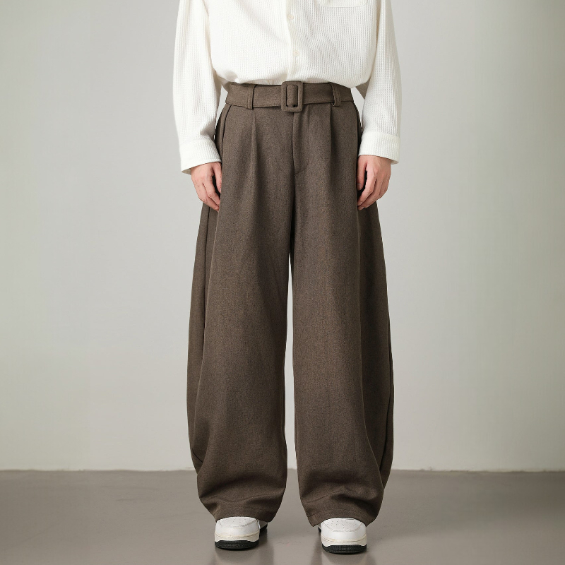 Relaxed fit men's wide leg trousers, high-waisted design, pleated details & an adjustable belt for modern fashion.