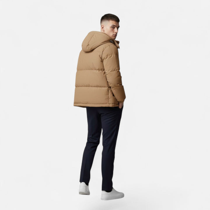 Close-up of men's hooded padded jacket fabric, highlighting its warm and durable winter outerwear material.