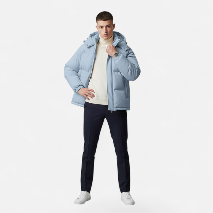 Folded men's warm hooded padded jacket, ready for travel and convenient storage as winter outerwear.
