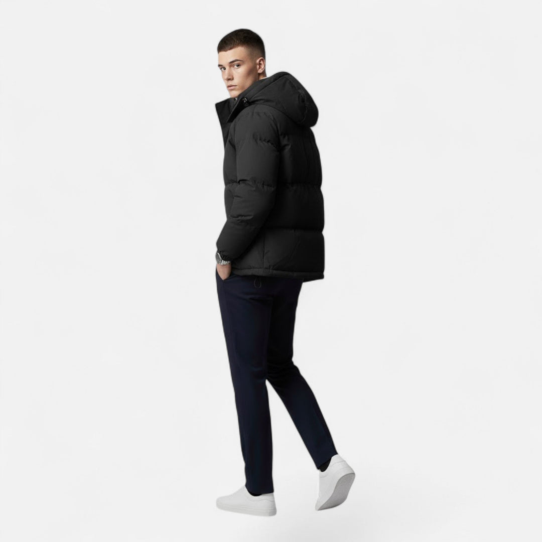 Cozy men's padded winter jacket featuring a hood, ideal for comfortable men's fashion in cold climates.