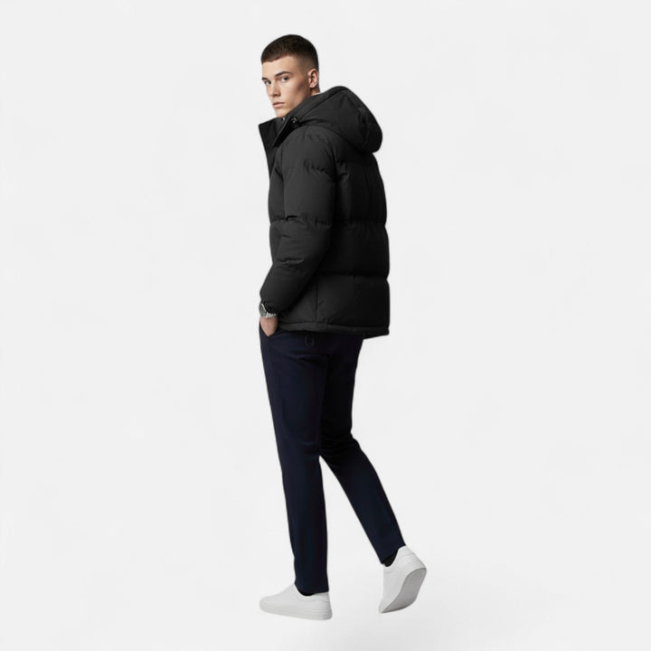 Cozy men's padded winter jacket featuring a hood, ideal for comfortable men's fashion in cold climates.