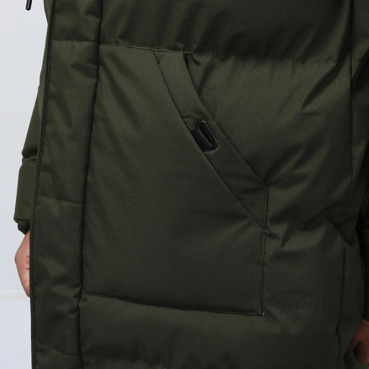 Detail shot of the zipper and hood on a men's casual quilted puffer coat for winter.