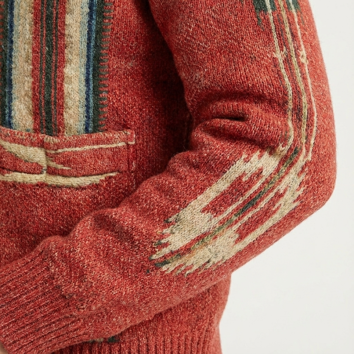 Detailed view of the lapel collar and button closure on this men's long sleeve knit cardigan.