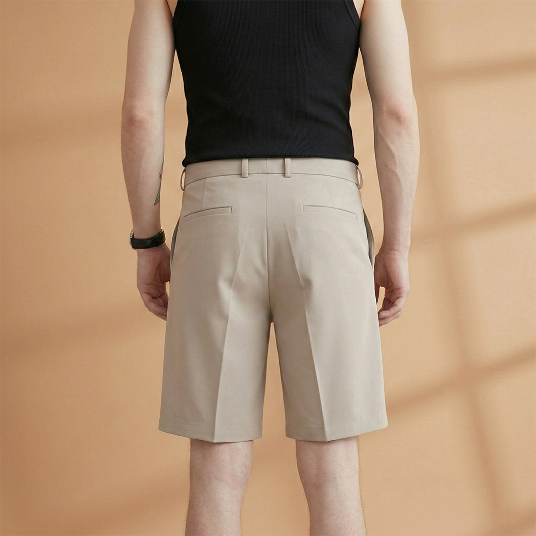 Classic men's black pleated casual shorts, knee-length, with belt loops for a tailored look & pockets.