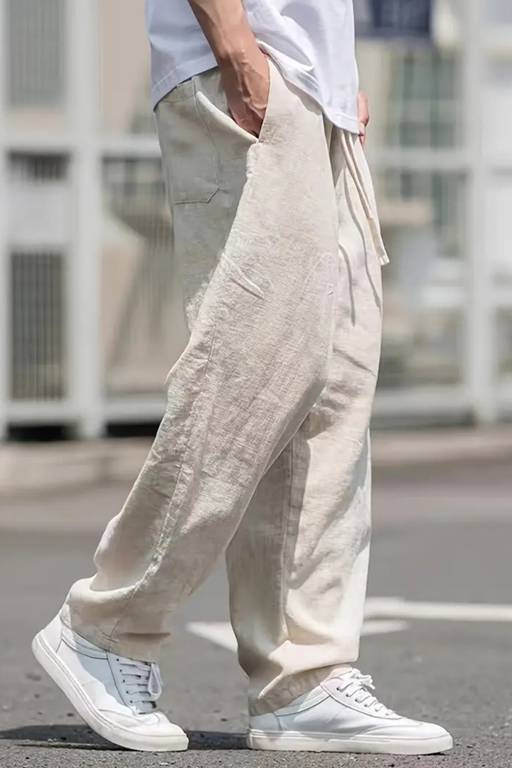 Stylish men's khaki wide leg trousers, designed with an elastic waist for modern men's fashion. Casual bottom.