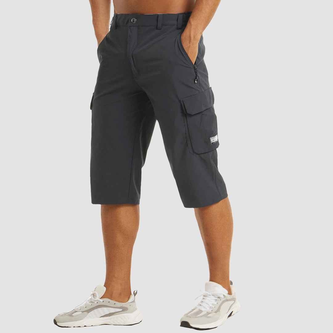 Men's cargo shorts with practical pockets, knee-length, great for outdoor adventures and summer fashion.