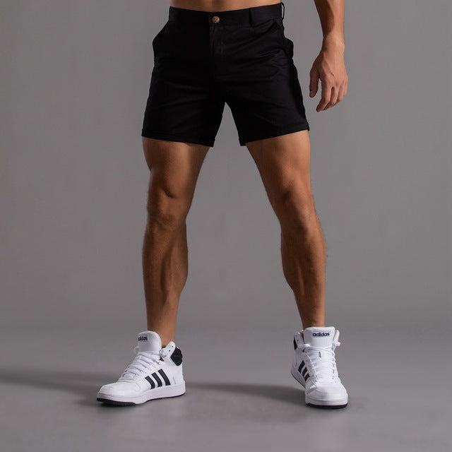 Comfortable men's knee-length chino shorts, essential for summer casual apparel.