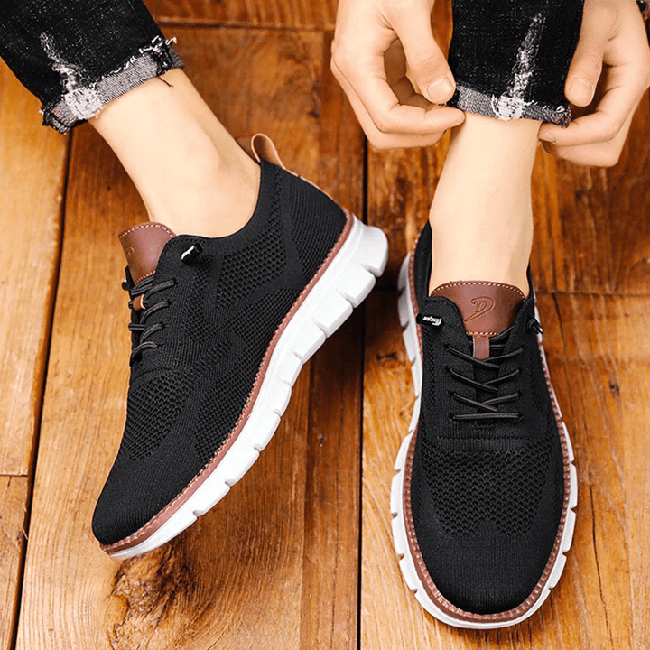 Stylish breathable men's sneakers with a comfortable round toe, great for everyday casual style.