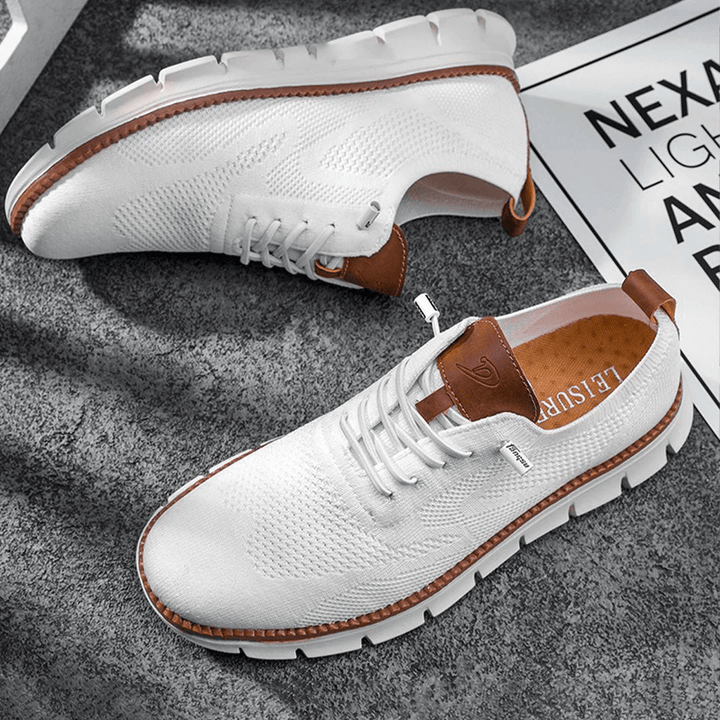 Everyday men's fashion: comfortable lace-up sneakers with a modern, breathable design for casual wear.