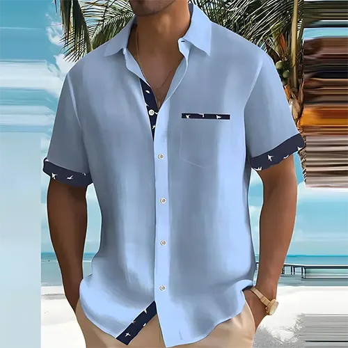 Model wearing the men's Liam summer shirt in green, showcasing its classic fit & versatile style.