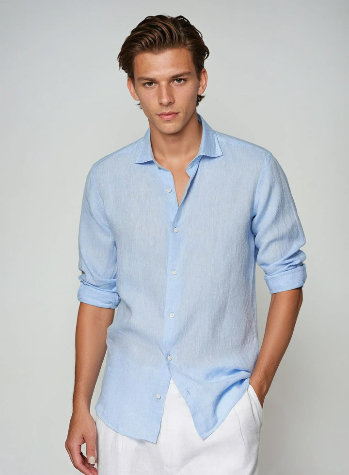Men's light blue breathable button-down shirt for casual summer wear. Relaxed fit, long sleeve.