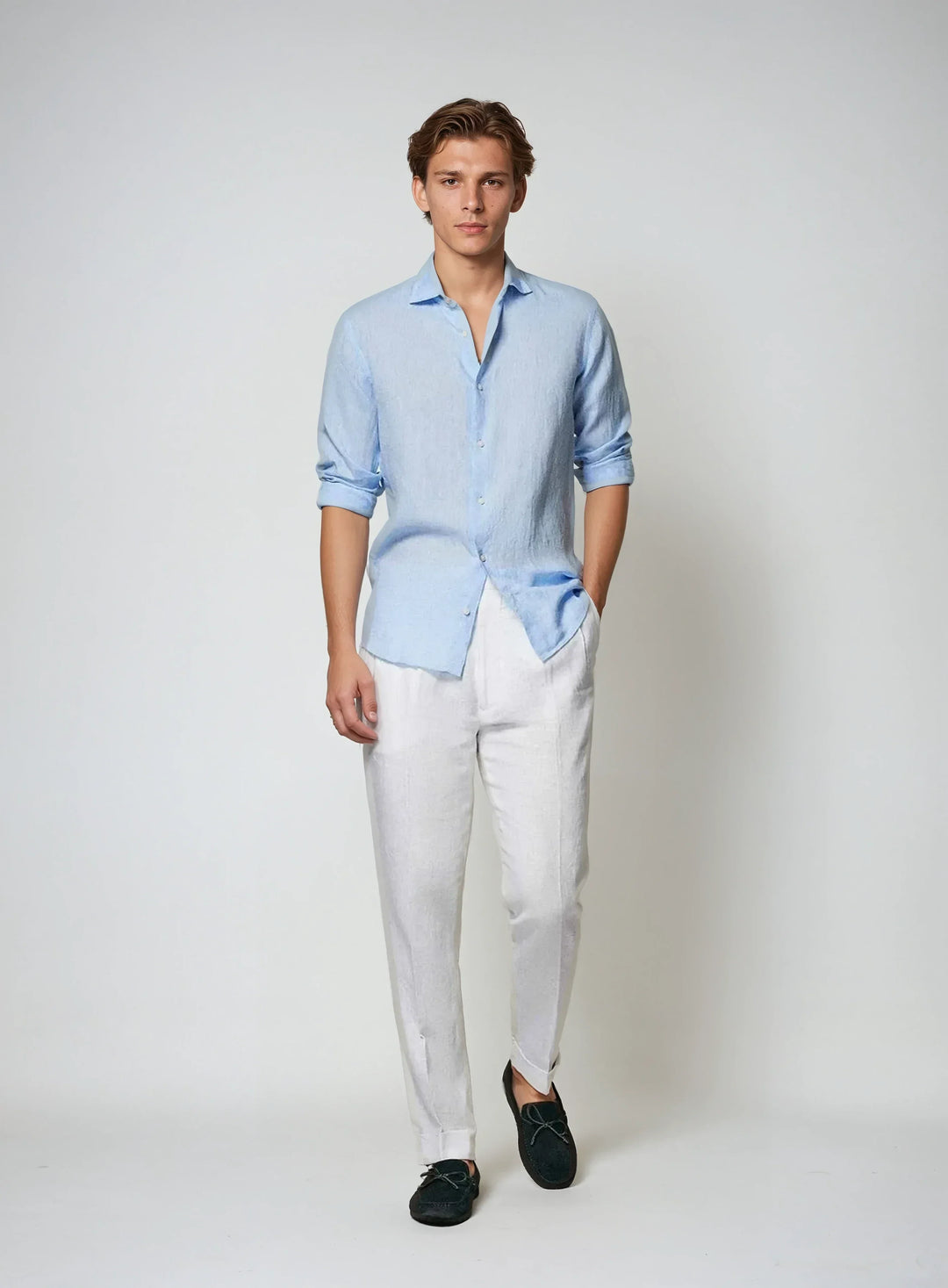 Men's relaxed fit breathable button-down shirt in light blue, ideal for versatile summer outfits.