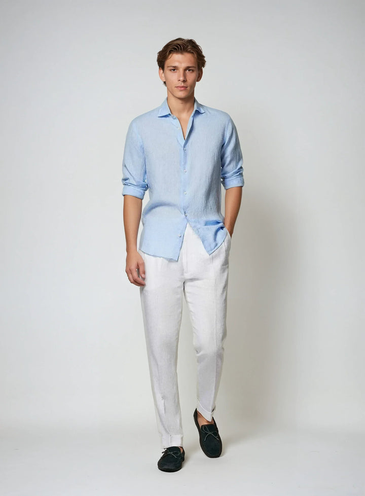 Men's relaxed fit breathable button-down shirt in light blue, ideal for versatile summer outfits.