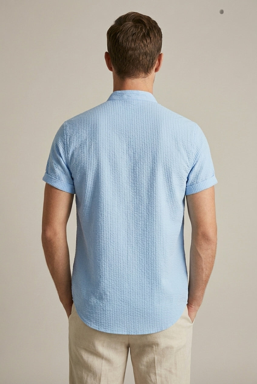 Versatile men's band collar seersucker shirt, light blue, short sleeve. Perfect for warm weather casual fashion.
