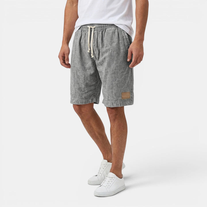 Summer men's beach shorts, lightweight drawstring design, great for vacation comfort.