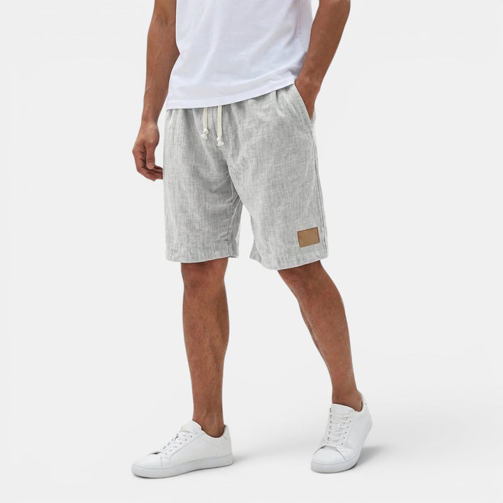 Travel-ready men's shorts, lightweight fabric & drawstring waist for ultimate beach comfort.