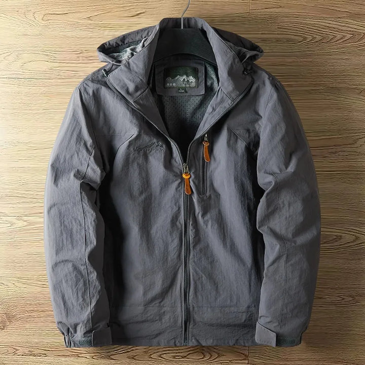 Men's outdoor hooded waterproof rain jacket, lightweight and durable for hiking & travel.