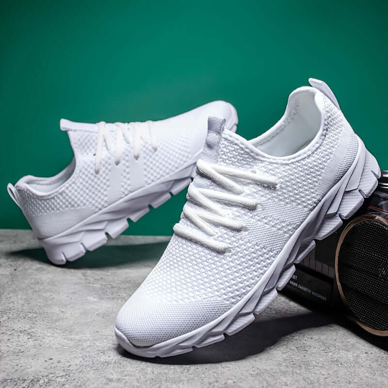 Side view: Men's lightweight knitted running shoes, comfortable athletic footwear with sporty style for active wear.