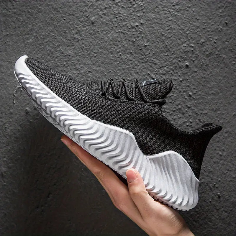 Comfortable men's walking shoes with a modern design & sculpted sole. Lightweight lace-up sneakers for daily use.