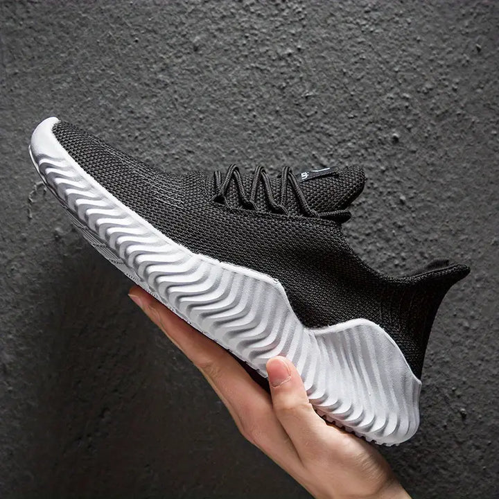 Comfortable men's walking shoes with a modern design & sculpted sole. Lightweight lace-up sneakers for daily use.