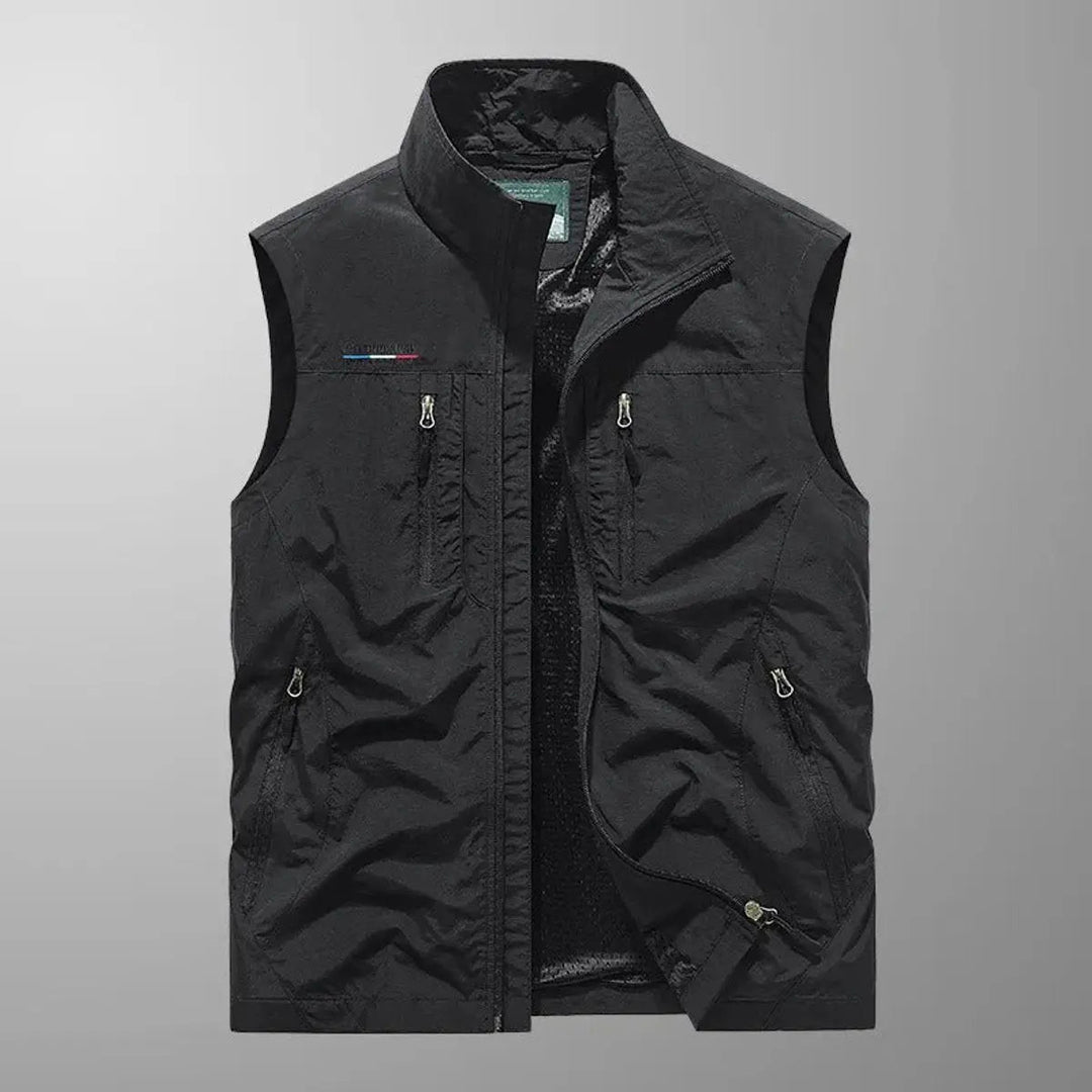 Utility men's outdoor vest with numerous pockets, ideal for fishing, photography, or carrying hiking gear. Water-resistant.